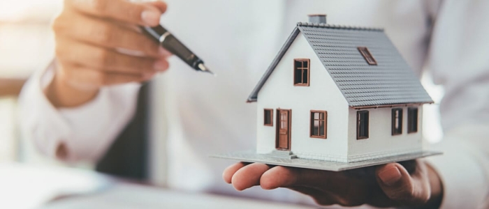 house-model-with-real-estate-agent-customer-discussing-contract-buy-house (1)