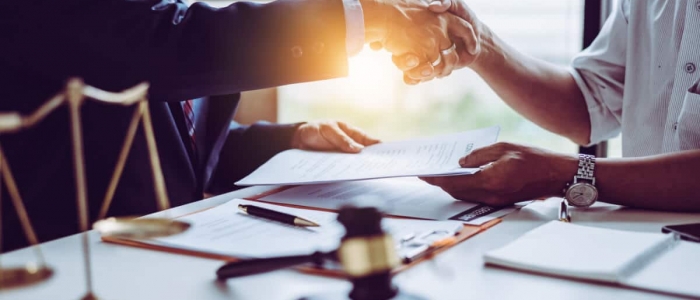 middle-age-asian-partner-lawyers-attorneys-shaking-hands-after-discussing-contract-agreement-done (1)